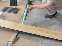 Step7: Apply structural adhesive evenly to the back of the wall panel