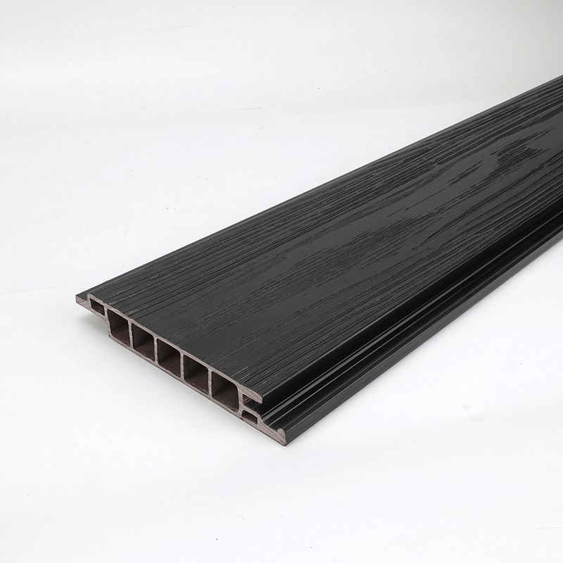 MCharcoal black WPC decking around infinity pool edgea